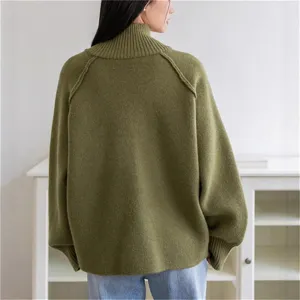 Women's olive green turtleneck knit sweater, loose fit casual autumn winter top detail view.