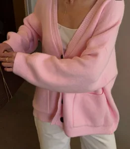 Pink V-neck knit cardigan for women, loose oversized button-down sweater with pockets.