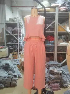 Detail view of pink linen blend two piece set crop top and wide leg pants warehouse.