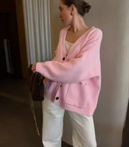 Cozy pink oversized knit cardigan for women, stylish V-neck design, perfect for daily warm wear.