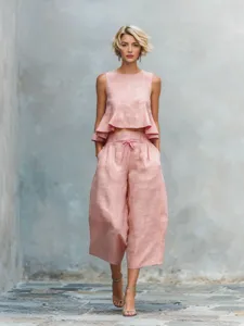 Summer linen blend two-piece set featuring a chic ruffle crop top and wide-leg pants.