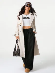 Detailed view of high-waisted wide-leg corduroy pants with drawstring, stylish drape.