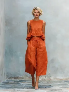 Chic women's linen blend two-piece set featuring a sleeveless ruffle top and cropped pants.
