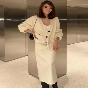 Beige knitted cardigan and long skirt set, comfortable button up casual wear.