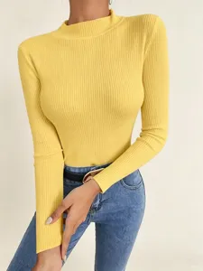 Close-up detail of a vibrant yellow ribbed mock neck sweater, slim fit knitwear fashion style.