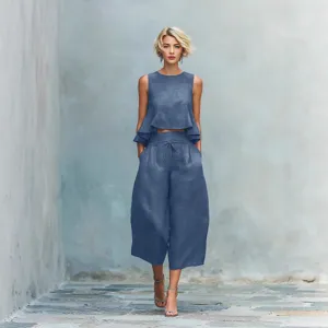 Women linen blend two-piece set with sleeveless ruffle crop top and wide-leg cropped trousers.