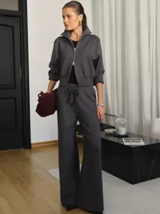 Grey knit zip-up cardigan and wide-leg trousers set, cozy fall outfit detail view.
