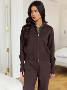 Detailed view of women's brown knit zip-up sweater set, showing soft texture and premium collar.