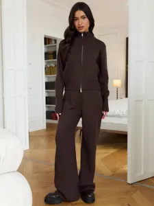 Detailed view of the cozy dark brown knit zip-up cardigan and matching wide-leg trousers set.