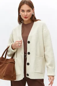 Cardigan de punto para mujer de manga larga con cuello en V, botones y bolsillos.