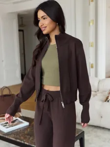 Brown knit zip-up jacket with green crop top and wide leg pants casual fashion two piece set