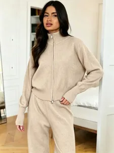 Beige knit zip-up sweater set detail, comfortable long-sleeve cardigan and wide-leg trousers.