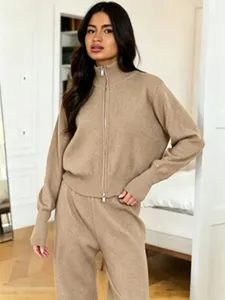 Details of the elegant two-piece knit sweater set featuring a chic zip cardigan and wide pants.