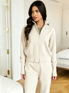 Cozy knit detail and casual indoor scene showcasing the soft half-zip sweater and pants set.