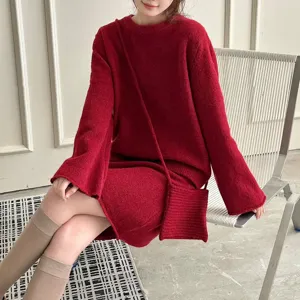 Detailed shot of the cozy red knit sweater and skirt, showcasing soft winter texture style.