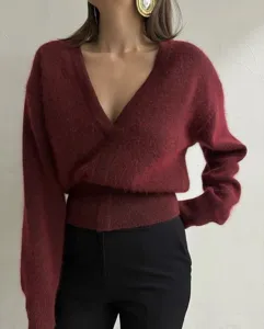 Women's V-neck fuzzy knit sweater detail view, stylish burgundy autumn winter top for ladies.