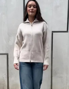 Zip-up knit cardigan detail, ribbed texture and high collar design for women comfort.