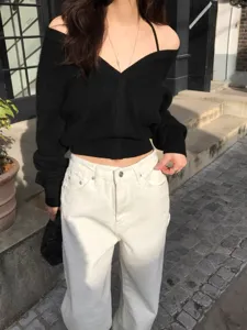 Chic women's V-neck knit sweater cardigan paired with stylish white pants, autumn winter fashion.
