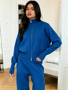 Detailed view of the stylish blue zip-up sweater and wide-leg trousers knit two-piece set.