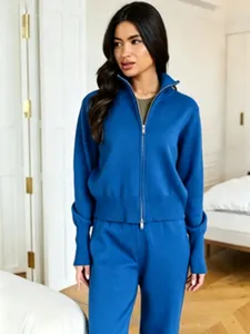 Detail view of the blue knit zip-up sweater and wide-leg trousers set for stylish daily wear.