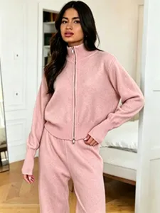 Detailed view of women pink knit zip up cardigan and wide leg pants loungewear set detail shot.