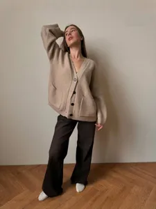 Oversized knit cardigan for women, thick V-neck button-down sweater, cozy casual daily winter wear.