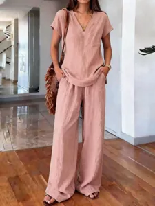 Detail view of the elegant solid color summer linen two piece outfit, wide leg pants.