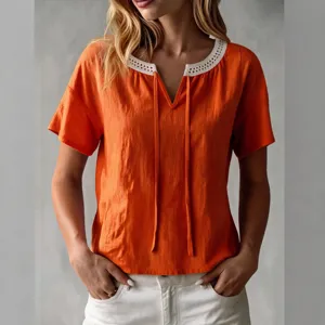 Trendy summer orange short-sleeve top featuring white lace V-neck with lovely ties.