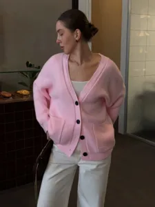 Women pink V-neck single-breasted knit cardigan sweater, casual loose outerwear daily wear.