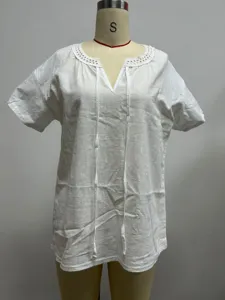 White short sleeve V-neck blouse with eyelet lace trim and tie detail, casual summer top.