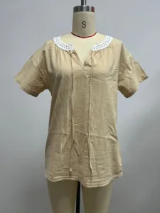 Summer casual V-neck short sleeve blouse with delicate white lace trim and tie detail.