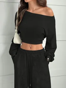 Detail view of women solid color casual set, off shoulder long sleeve top and loose sweatpants.