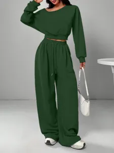 Solid color casual sweatsuit with off-shoulder sweatshirt and wide-leg pants for women.