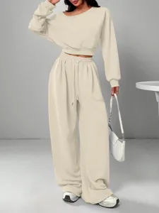 Women's off-shoulder casual two-piece tracksuit featuring a loose crop top and wide-leg pants.
