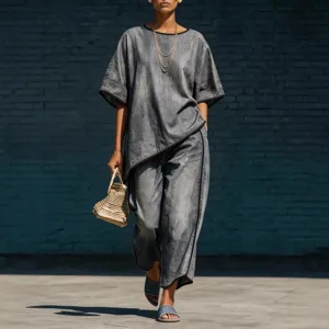 Chic loose denim two-piece set featuring casual wide-leg pants and stylish top for women.