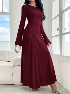 Burgundy long sleeve maxi dress detail, fitted silhouette with elegant trumpet sleeves.