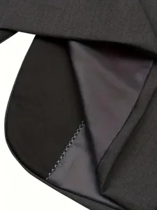 Close-up view of men suit fabric showing fine stitching texture and lining quality.