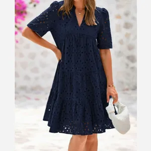 Navy blue V-neck short sleeve eyelet tiered mini dress for women summer fashion style.
