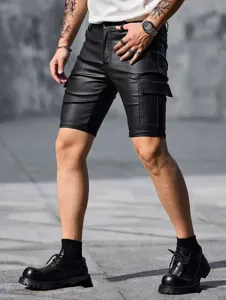 Detail view of men's black PU leather cargo shorts, showing pocket texture and slim fit.