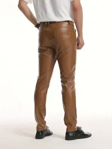 Back view detail of men's slim brown PU leather pants showing pocket and fabric texture.