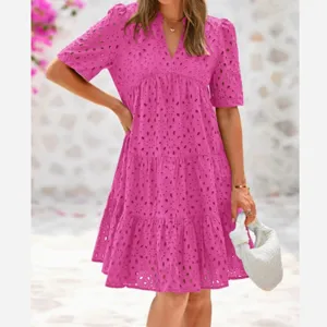 Pink V-neck short sleeve eyelet midi dress featuring tiered ruffle hem for summer style detail.