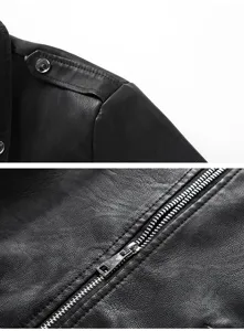 Detail view of black leather biker jacket showing shoulder epaulet and metal zipper.
