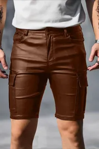 Detailed view of men brown PU leather cargo shorts with slim fit and side pockets.