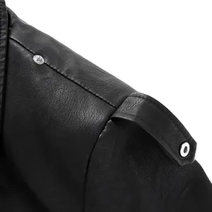 Close-up detail of women's black faux leather motorcycle jacket with metal snap buttons.