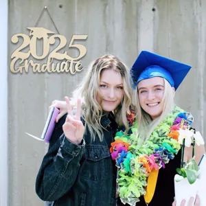 Wooden graduation sign detail view featuring 2025 graduate design for party decoration prop.