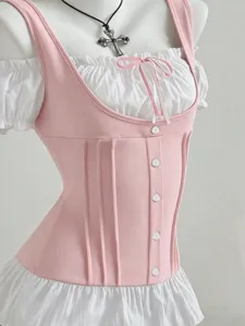 Close-up detail view of the pink corset top with white ruffled sleeves and bow design.