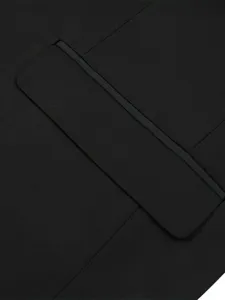 Men's suit jacket pocket detail, premium black fabric close-up shot for formal wear style.