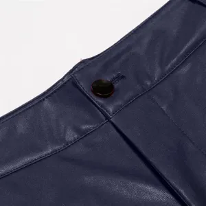 Close-up view of dark blue PU leather pants waistband with button detail and fine stitching.