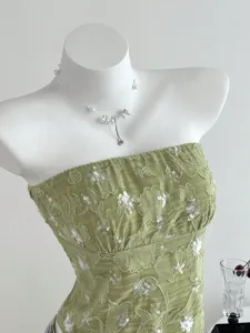 Green sequin textured strapless top detail view, perfect for summer chic casual stylish wear.