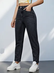 Detail view of women high waist tapered denim jeans in dark wash casual everyday style.
